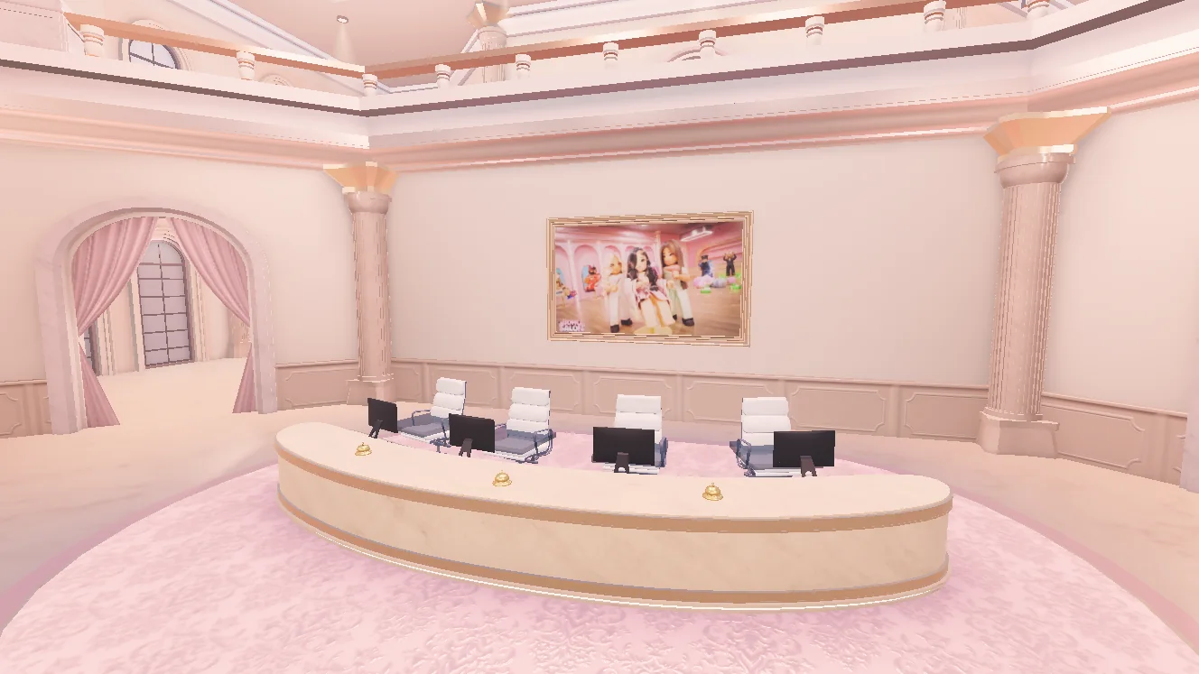 Boho Salon reception with a curved welcome desk and pink interior